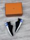 Hermes knit sneaker zwart met lavendelblauwe H en witte zool
